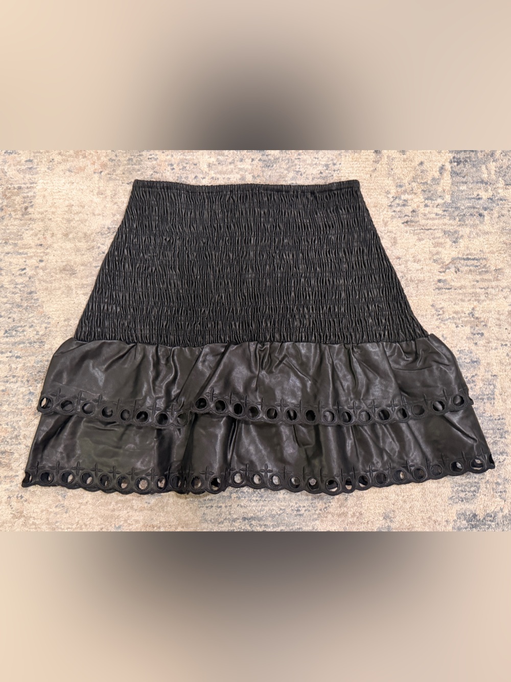 Stellah Black Eyelet-Tier Mini Skirt in Leather Like Fabic